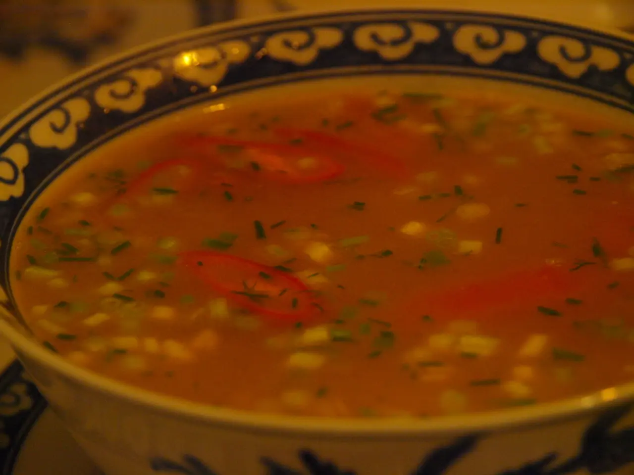 In the picture I can see a bowl in which there is a soup.