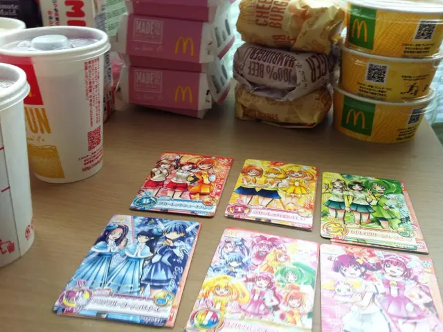 In this picture I can see the brown color surface on which there are six cards on which there are...