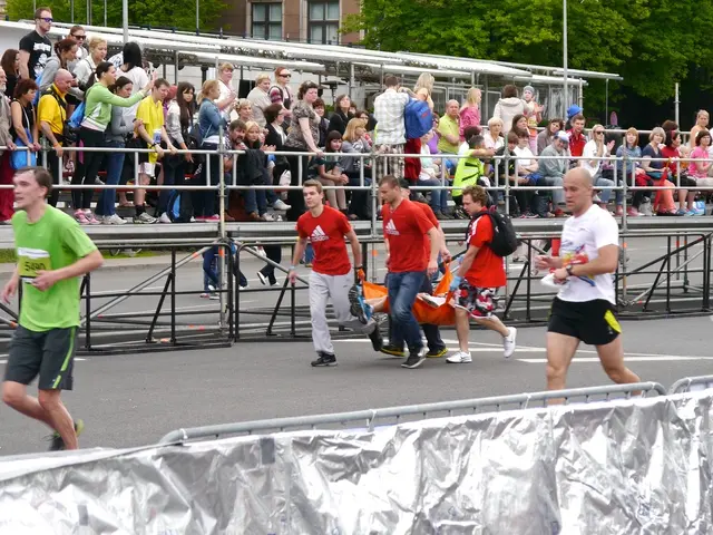 In this image we can see there are some people running on the road. In the background of the image...