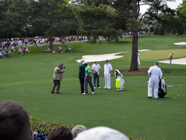 In this image there are a few people playing golf on the golf course, besides them there are kits,...